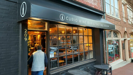 An awning for Curio Wine Bar & Tasting Room, created by Distinct Sign Solutions (DSS).
