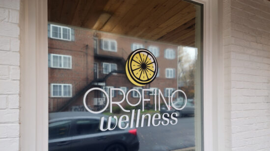 A vinyl window graphic for Orofino Wellness, created by Distinct Sign Solutions (DSS).