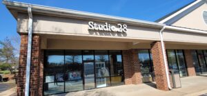 alt="Photo of white channel letter sign for photography studio in Spotsylvania, Virginia"