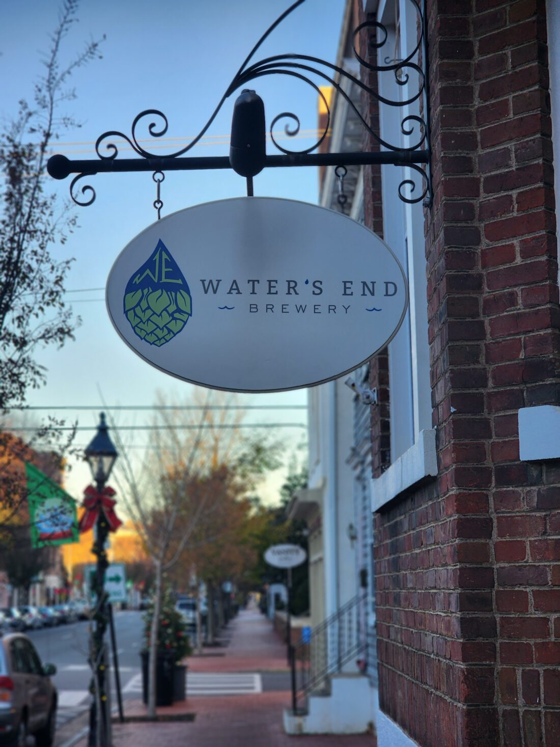 alt="Photo of hanging brewery blade sign located in Downtown Fredericksburg, Virginia"