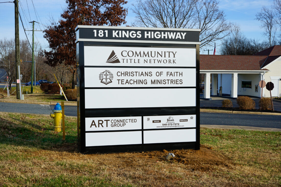 alt="Photo of duranodic bronze monument sign with various tenant panels located in Stafford, Virginia"