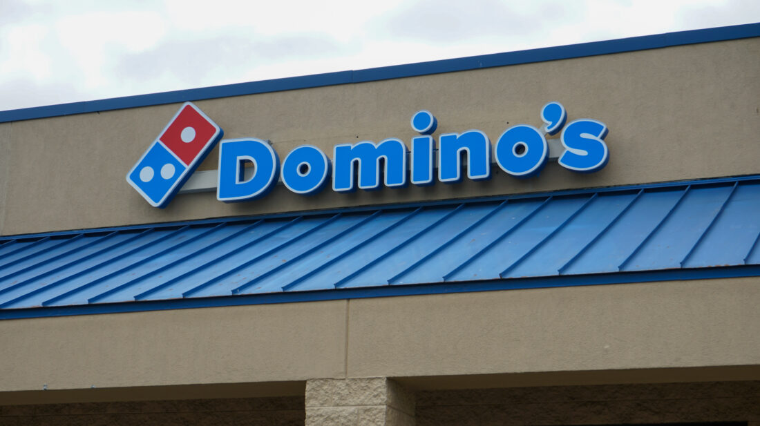 alt="Photo of blue and red Domino's pizza channel letter sign mounted with raceway, located in Stafford, Virginia"