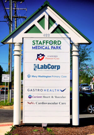 alt="Photo of medical park monument sign with various tenant panels located in Stafford, Virginia"