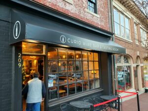 An awning for Curio Wine Bar & Tasting Room, created by Distinct Sign Solutions (DSS).