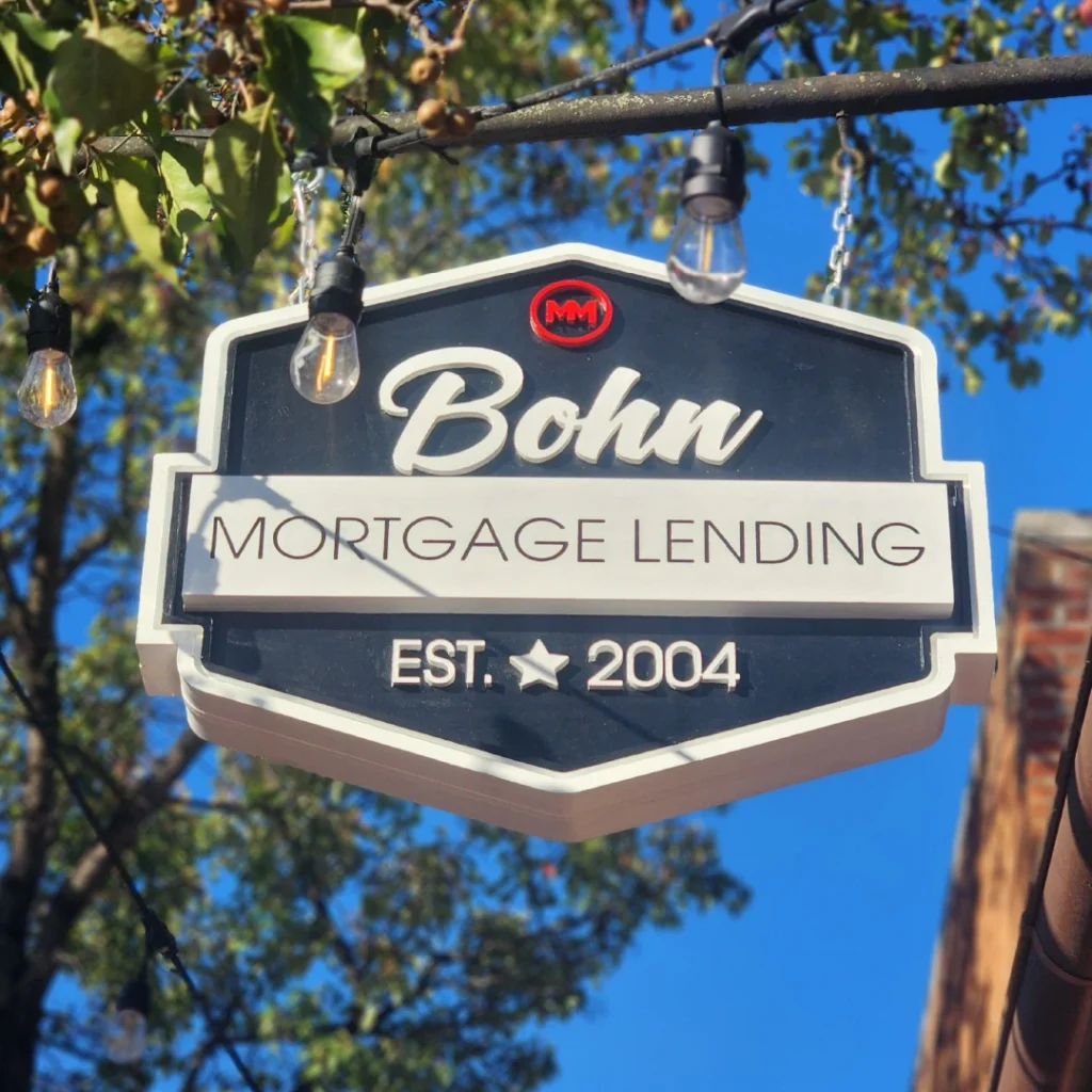 A hanging blade sign for Bohn Mortgage showcasing vibrant 3D elements, located in Fredericksburg, VA, created by Distinct Sign Solutions.