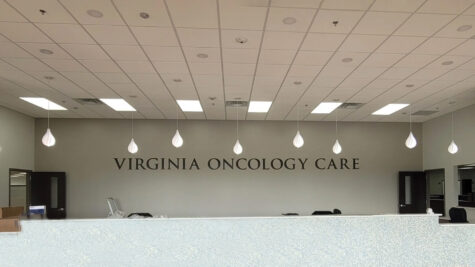 Interior office signage for the Virginia Oncology Care Center in Fredericksburg, VA, created by Distinct Sign Solutions. An example of an effective healthcare sign.