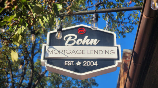 A hanging blade sign for Bohn Mortgage showcasing vibrant 3D elements, located in Fredericksburg, VA, created by Distinct Sign Solutions.