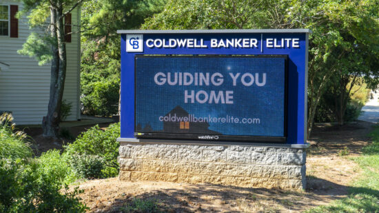 An electronic message board for Coldwell Banker Elite displaying the message, "Guiding You Home," created by Distinct Sign Solutions (DSS).