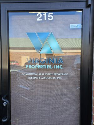 alt="Photo of business entrance door with Custom Printed Vibrant colored graphics for Virginia Properties located in Spotsylvania, Virginia"