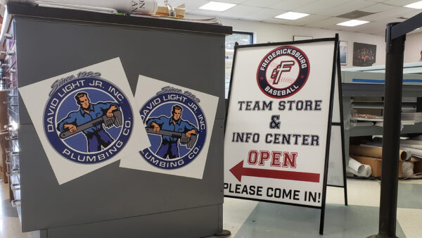 An A-frame sign for the Fred Nats team store and David Light Jr. Plumbing Co. magnets created by Distinct Sign Solutions in Fredericksburg, VA.