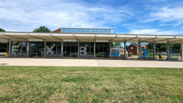 FXBGO vinyl graphics at the local bus station with bold letters and vibrant colors for clear wayfinding, created by Distinct Sign Solutions in Fredericksburg, VA.