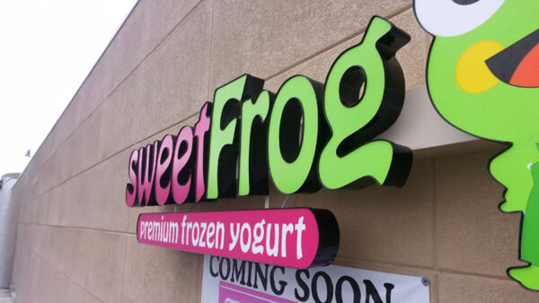 A sign angle shot of one of the ice cream signs for Sweet Frog, Premium Frozen Yogurt, installed by Distinct Sign Solutions in Fredericksburg, VA. 