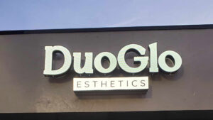 Distinct Signs' channel letter sign with night vinyl for DuoGlo Esthetics, showcasing a bright, glowing appearance at night.