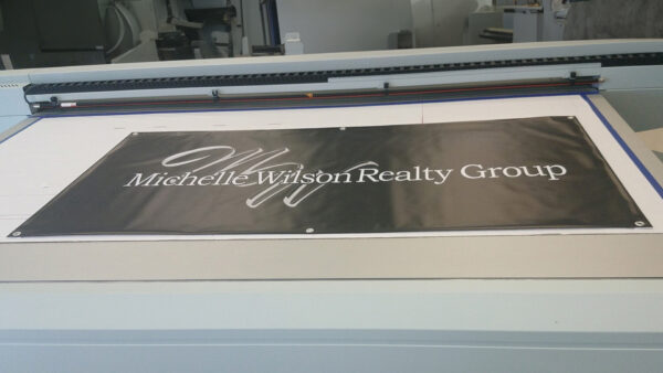 Black and white banner for Michelle Wilson Realty Group created using wide format printing by Distinct Signs in Fredericksburg, VA.