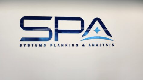 Photo of blue acrylic wall sign for Systems Planning & Analysis in Alexandria, VA. Sign manufactured & installed by Distinct Sign Solutions in Fredericksburg, VA