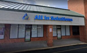 Photo of channel letter sign displaying ALL IN SOLUTIONS, located in Spotsylvania, VA. Sign was manufactured & installed by Distinct Sign Solutions in Fredericksburg, VA