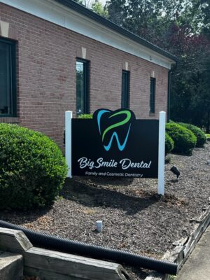 Photo of monument post & panel sign in mulch bed to great visitors at Dentist office in Fredericksburg, VA. Sign was manufactured & installed by Distinct Sign Solutions in Fredericksburg, VA