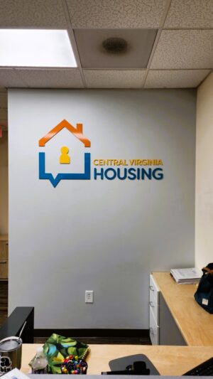 Photo of acrylic wall sign for Central Virginia Housing Coalition in Fredericksburg, VA. Sign was manufactured & installed by Distinct Sign Solutions in Fredericksburg, VA