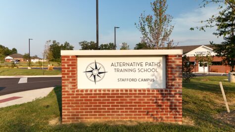 Photo of brick monument with white & blue sign panel in Stafford, VA. Sign was manufactured & installed by Distinct Sign Solutions in Fredericksburg, VA