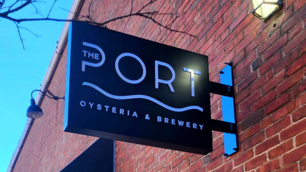 A downtown sign created by Distinct Signs for the Port Oysteria and Brewery. A blade sign.