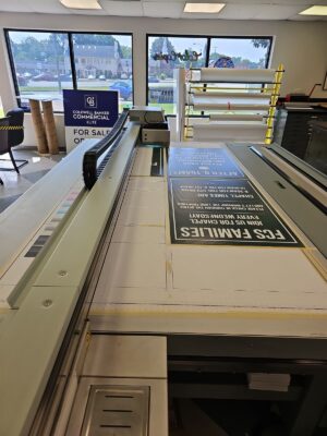 Photo of several FCS signs being printed on a flatbed printer, located in Fredericksburg, VA by Distinct Sign Solutions