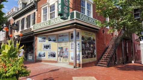 Photo of Fredericksburg's famous Goolrick's Pharmacy adorned with custom window graphics displaying historical photos & nostalgic memories. Located in Fredericksburg, VA; graphics manufactured & installed by Distinct Sign Solutions in Fredericksburg, VA