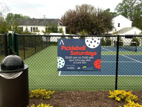 Photo of Atlantic Builder's Pickball banner affixed to fence in Spotsylvania, VA. Banner was manufactured & installed by Distinct Sign Solutions in Fredericksburg, VA