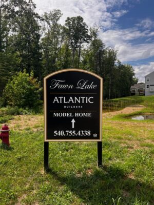 Photo of black & gold real estate post & panel sign in Spotsylvania, VA. Sign was manufactured & installed by Distinct Sign Solutions in Fredericksburg, VA