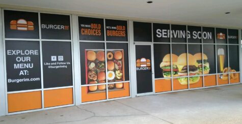 Photo of restaurant storefront with colorful burger graphics in Fredericksburg, VA. Graphics were manufactured & installed by Distinct Sign Solutions in Fredericksburg, VA