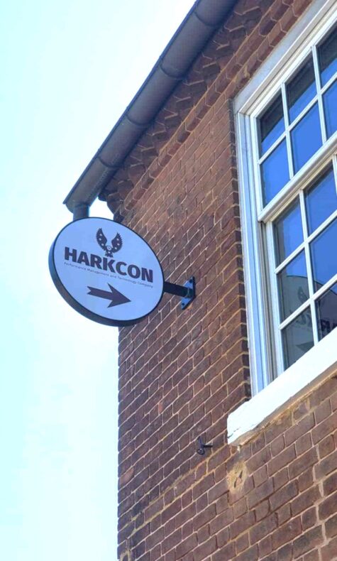 Photo of blade sign installed in brick building in Stafford, VA. Sign was manufactured & installed by Distinct Sign Solutions in Fredericksburg, VA