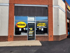 Photo of various Midas vinyl graphics on storefront in Manassas, VA. Graphics were manufactured & installed by Distinct Sign Solutions in Fredericksburg, VA