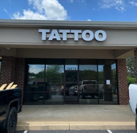 Photo of white channel letter sign displaying TATTOO, in Spotsylvania, VA. Sign was manufactured & installed by Distinct Sign Solutions in Fredericksburg, VA