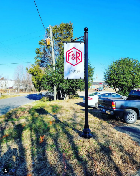 Photo of custom logo & address on pole sign for entrance at engineering company in Spotsylvania, VA. Sign was manufactured & installed by Distinct Sign Solutions in Fredericksburg, VA