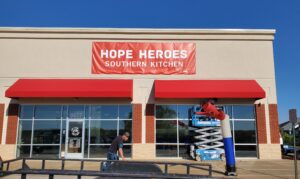 Photo of new red awnings for restaurant storefront in Spotsylvania, VA. Awnings were installed by Distinct Sign Solutions in Fredericksburg, VA