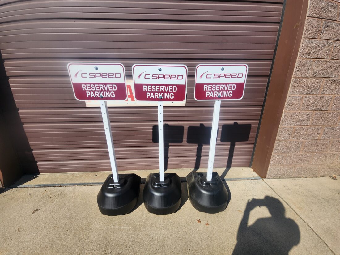 Photo of 3 Reserved Parking Signs on roll bases for C Speed in Stafford, VA. Signs were manufactured by Distinct Sign Solutions in Fredericksburg, VA