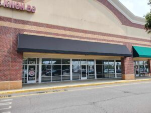 Photo of new black awning in Spotsylvania, VA. Awning was manufactured & installed by Distinct Sign Solutions in Fredericksburg, VA