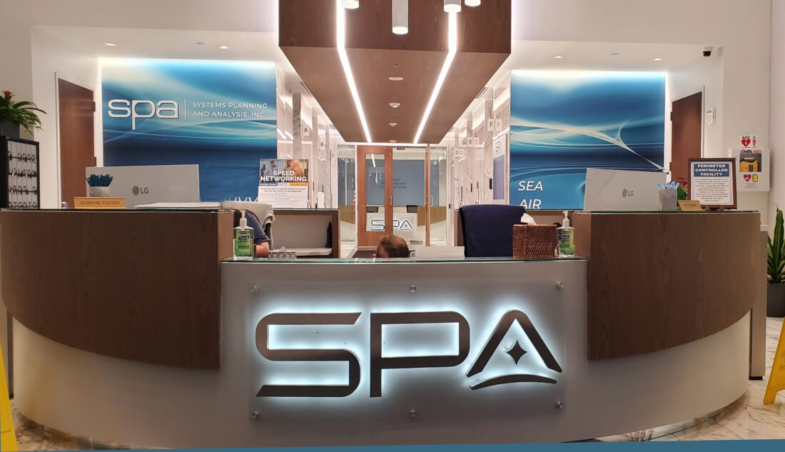 Photo of halo illuminated receptionist desk sign for SPA in Alexandria, VA. Sign was manufactured & installed by Distinct Sign Solutions in Fredericksburg, VA