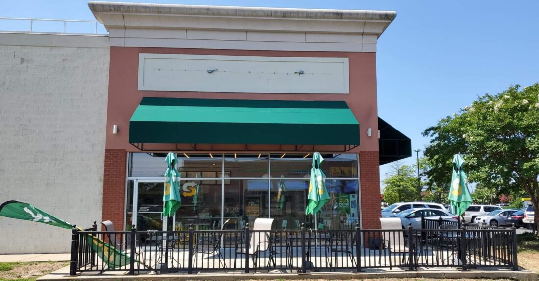 Photo of green awning located on Subway in Fredericksburg, VA. Awning was recovered by Distinct Sign Solutions in Fredericksburg, VA