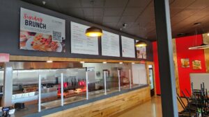 Photo of custom menus on restaurant wall in Spotsylvania, VA. Menus were custom made & installed by Distinct Sign Solutions in Fredericksburg, VA