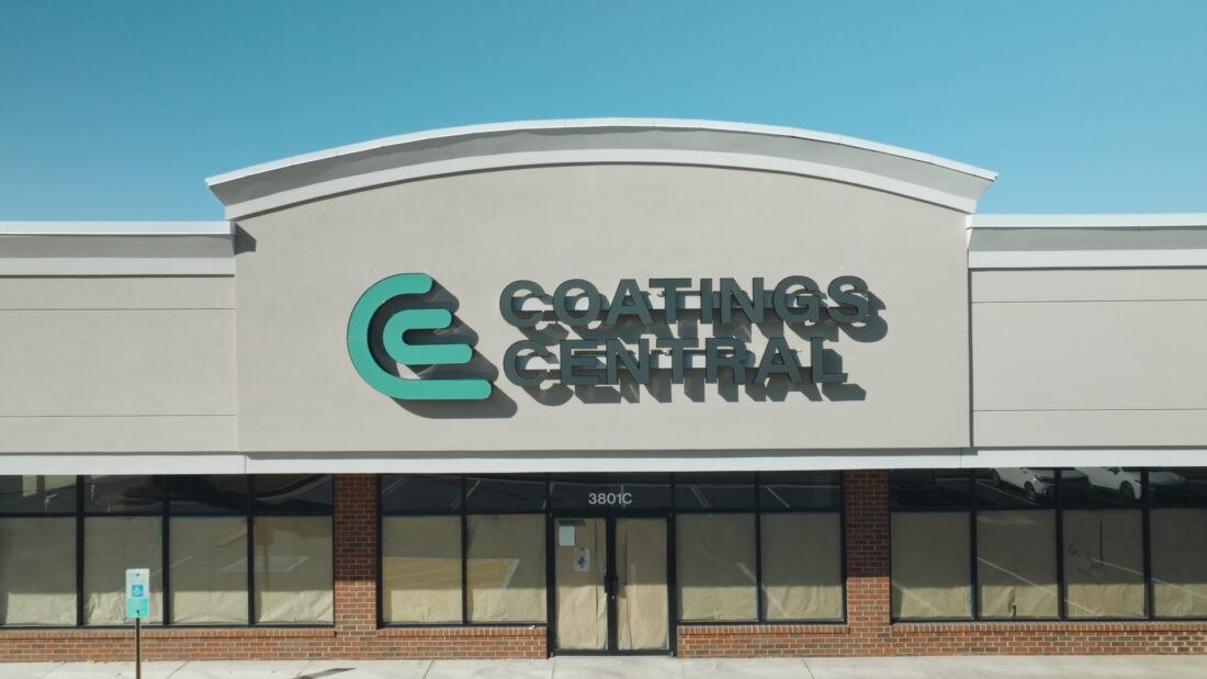 Photo of black and seafoam green channel letter sign on wall in Spotsylvania, VA. Sign was manufactured & installed by Distinct Sign Solutions in Fredericksburg, VA