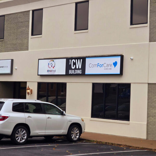 Exterior signage for CW Building featuring tenant names, designed for easy updates to accommodate tenant changes.