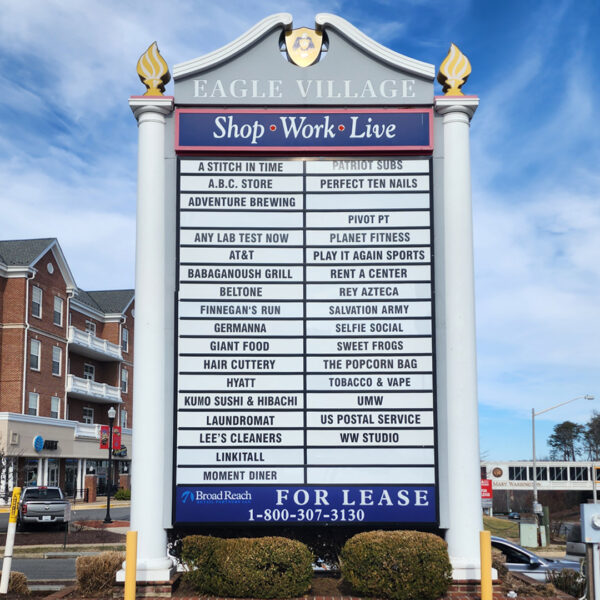 Large retail and office directory sign at Eagle Village, featuring replaceable panels for future tenant modifications.