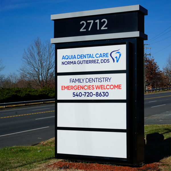 Monument sign with interchangeable tenant panels, designed for long-term property management flexibility.