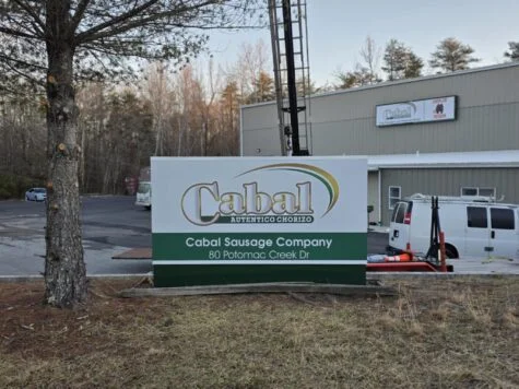 Photo of Cabal Sausage custom monument sign at entrance of factory in Stafford, VA. Sign was manufactured & installed by Distinct Sign Solutions in Fredericksburg, VA