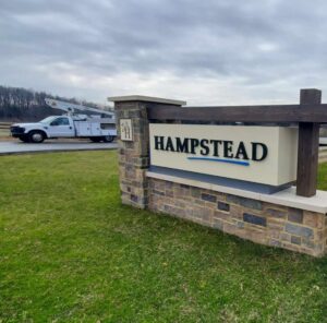 Photo of ornate monument subdivision sign for Hampstead by Atlantic Builders in Stafford, VA. Sign was manufactured & installed by Distinct Sign Solutions in Fredericksburg, VA