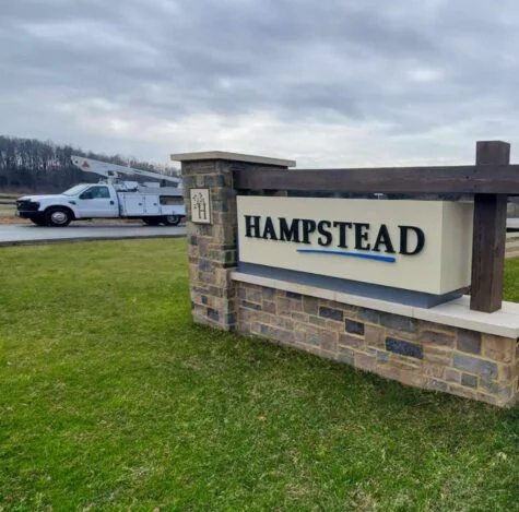Photo of ornate monument subdivision sign for Hampstead by Atlantic Builders in Stafford, VA. Sign was manufactured & installed by Distinct Sign Solutions in Fredericksburg, VA