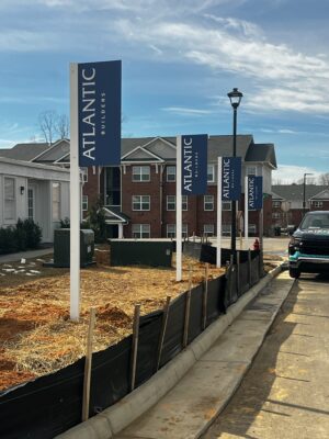 Photo of multiple aluminum blade/flag signs for Atlantic Builders in Spotsylvania, VA. Signs were manufactured & installed by Distinct Sign Solutions in Fredericksburg, VA