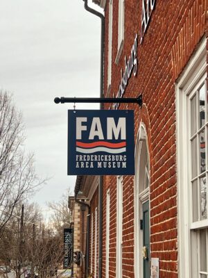Photo of hanging blade sign on steel bracket for FAMVA, located in Fredericksburg, VA. Sign was manufactured & installed by Distinct Sign Solutions in Fredericksburg, VA