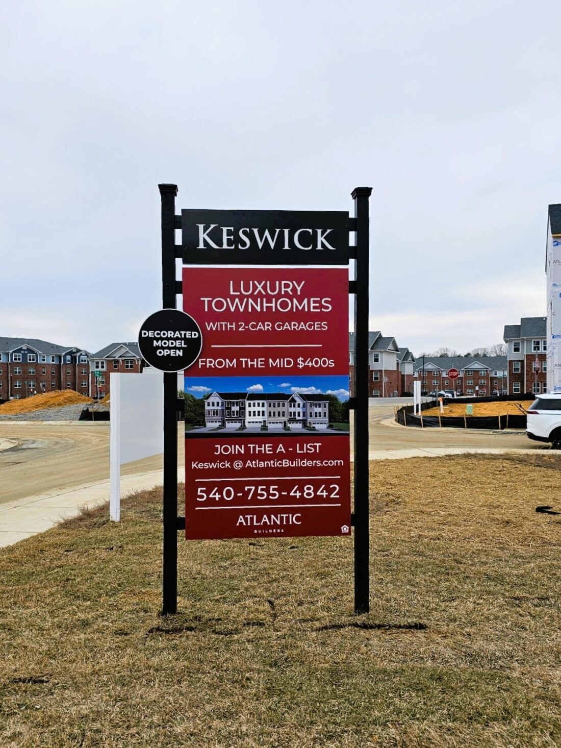 Photo of black & red home builder sign for Atlantic Builders in Spotsylvania, VA. Sign was manufactured & installed by Distinct Sign Solutions in Fredericksburg, VA