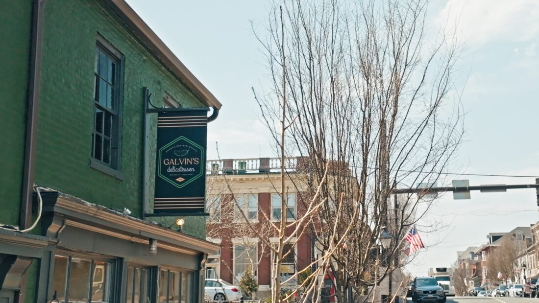 Photo of Galvin's Deli Blade sign on green building in downtown Fredericksburg. Sign was manufactured by Distinct Sign Solutions in Fredericksburg, VA